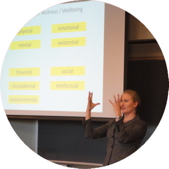 Katherine Sauer gesturing during a presentation